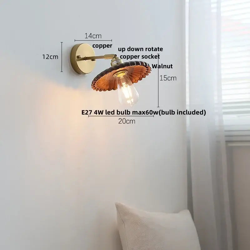 Walnut and brass wall sconce with copper scalloped shade and exposed edison bulb featuring pull chain switch