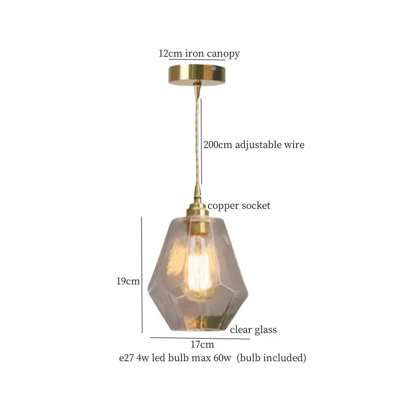 A warm brass cracked glass led pendant light with faceted clear glass shade and copper socket for kitchen decorbites