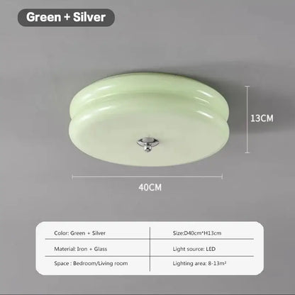 A sleek round warm chrome double layer glass led ceiling light with translucent green glass dome and silver frame for bedroom