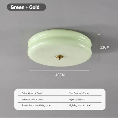 A sleek warm chrome ceiling light with pale green double layer glass led diffuser and gold-toned iron fixture