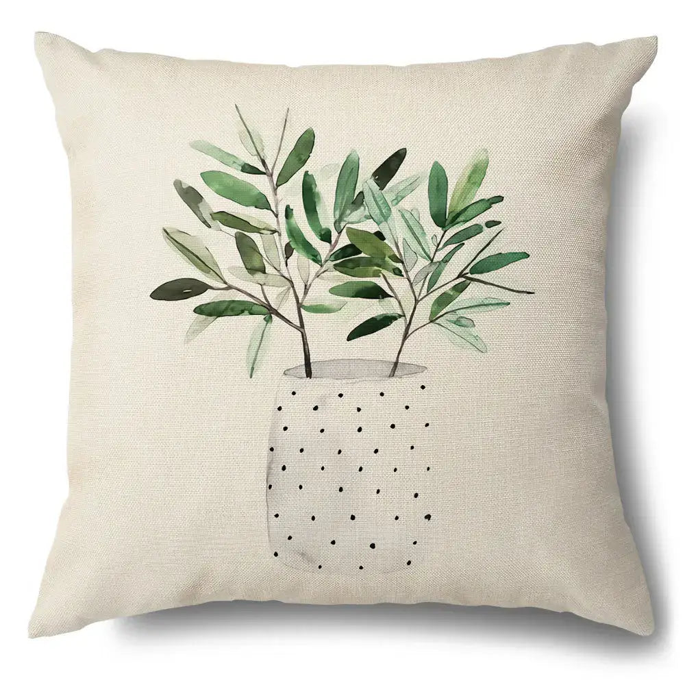 Beige linen pillow case with watercolor green leaves decorative illustration in a polka-dotted vase for living room