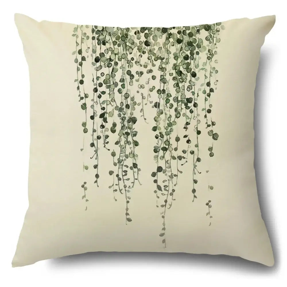Cream-colored cotton pillow case with watercolor green leaves decorative design for living room use
