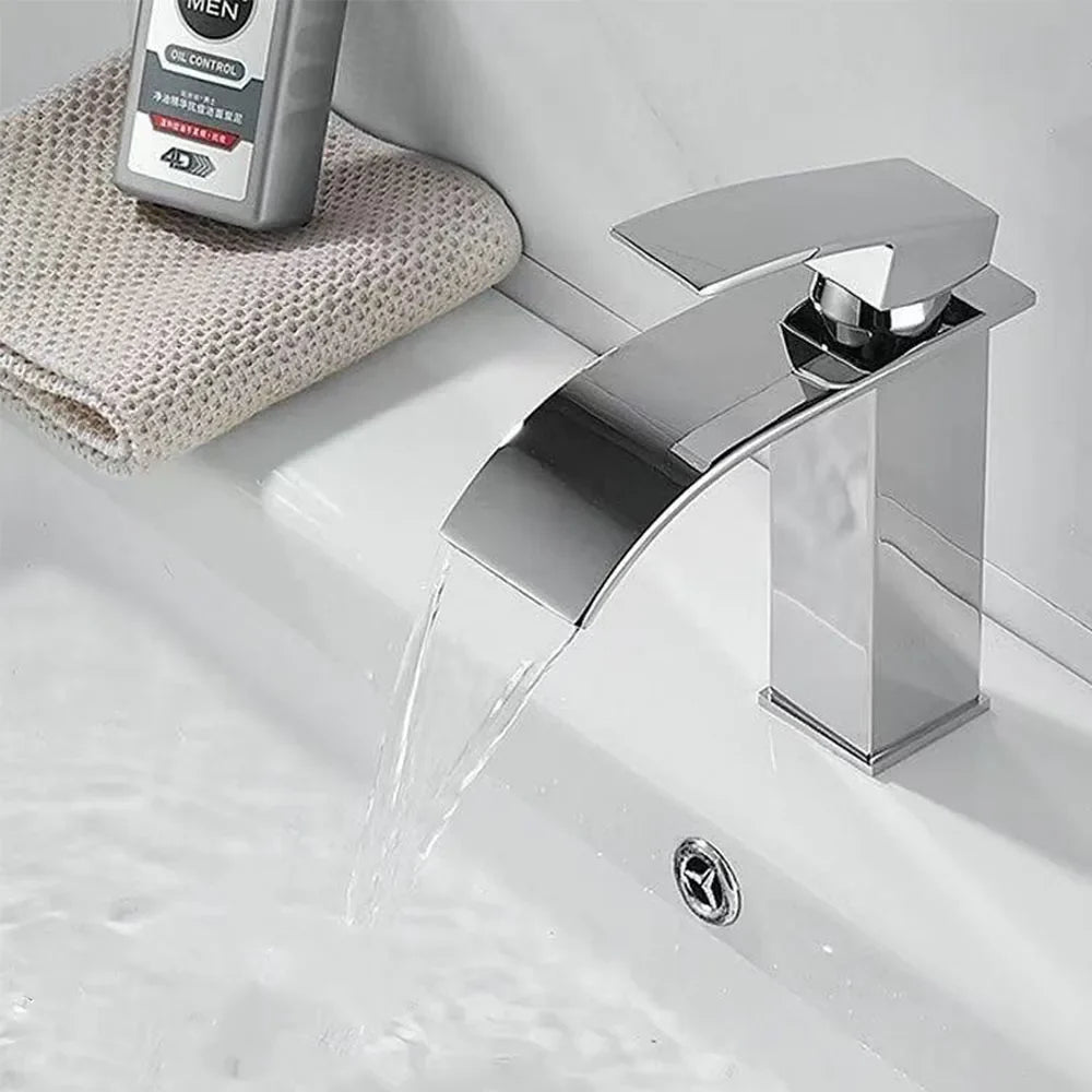 Modern chrome finished stainless steel waterfall faucet with sleek angular design for wash basin bathroom use