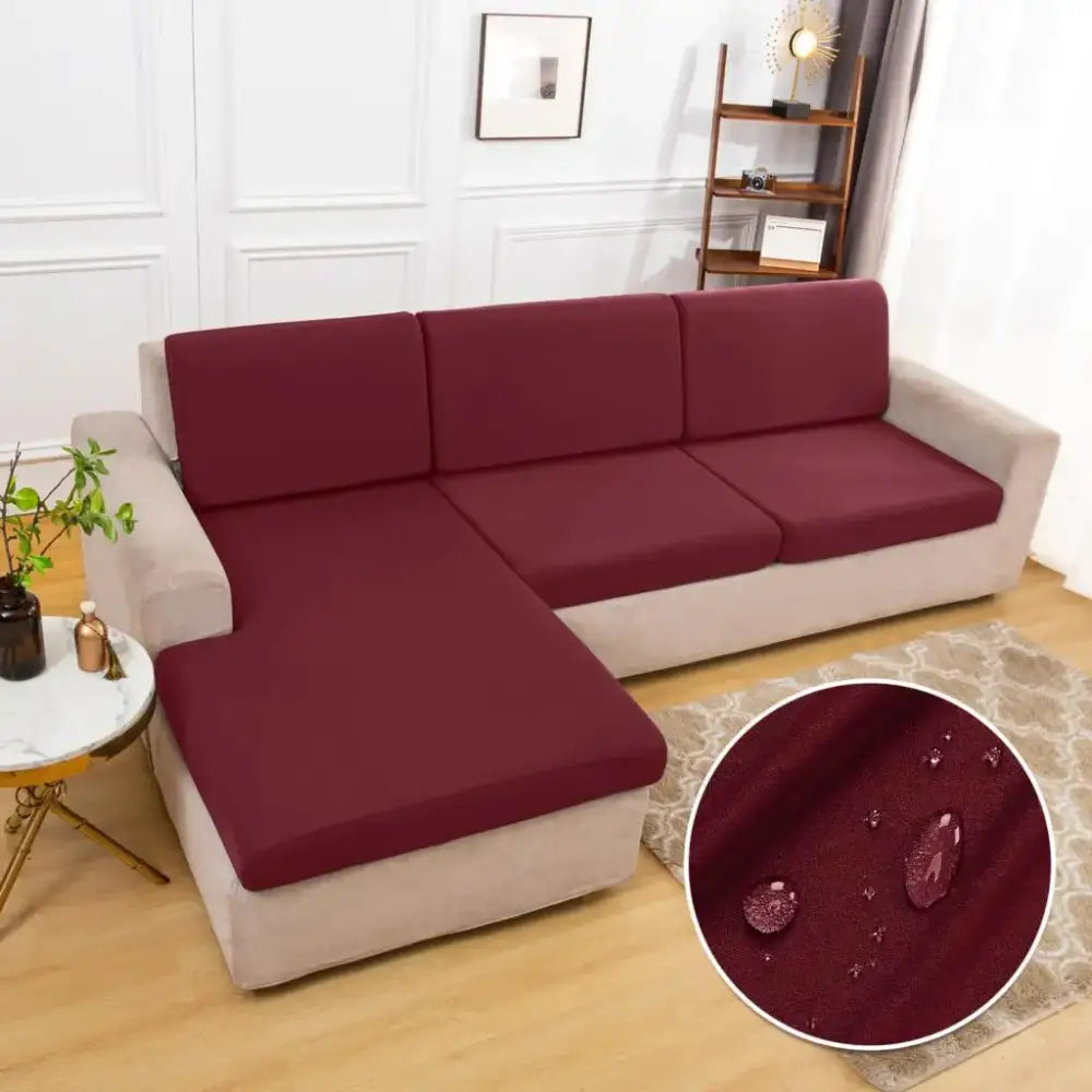 Maroon waterproof stretch fabric sofa cover for l-shaped sectional featuring elastic fit and water-resistant protection