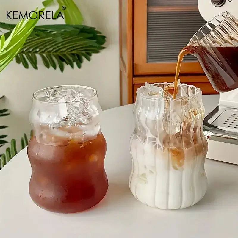 Two clear wavy ribbed glass cups with rounded bases 500ml ins glass tumblers for kitchen use