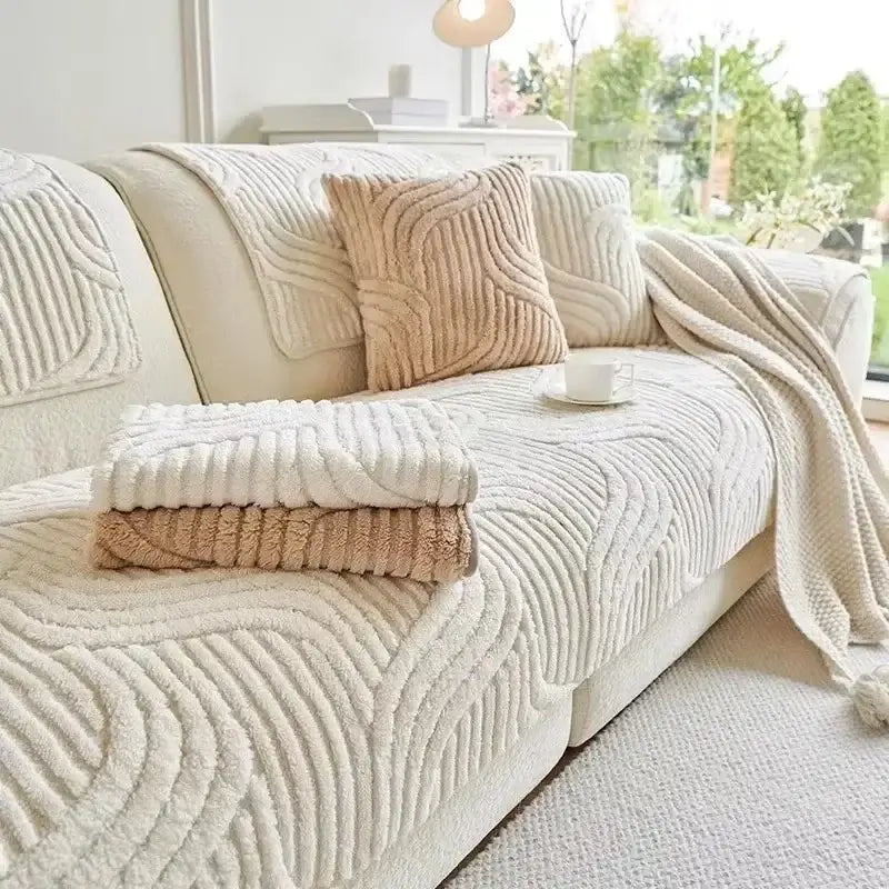 Cream-colored plush sofa cover with ribbed wave pattern made of soft fabric for living room set