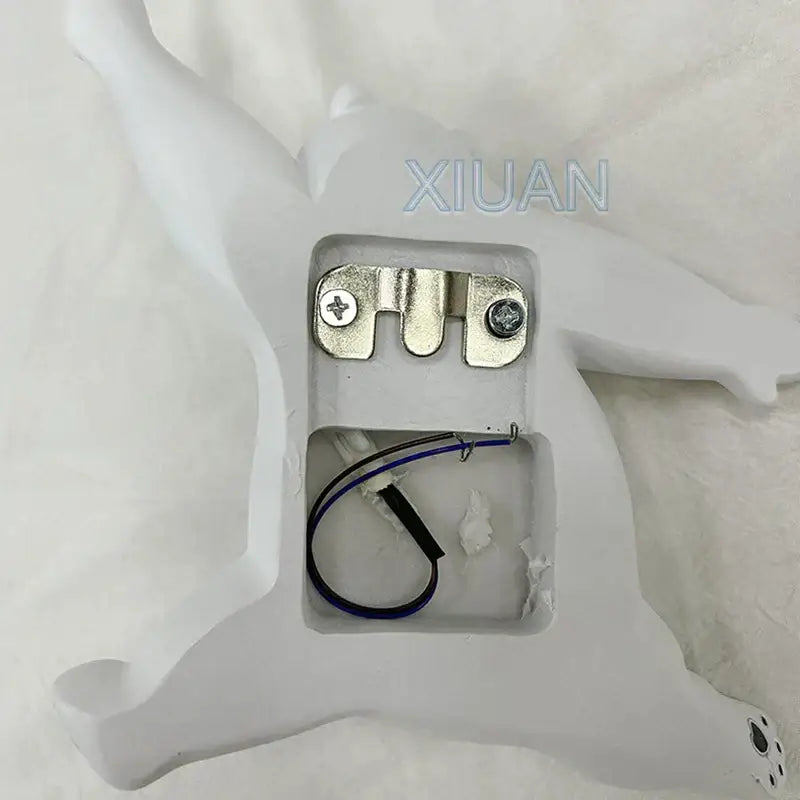 White resin horse-shaped wall lamp with metallic bracket and wiring for whimsical kids bear wall lamp design