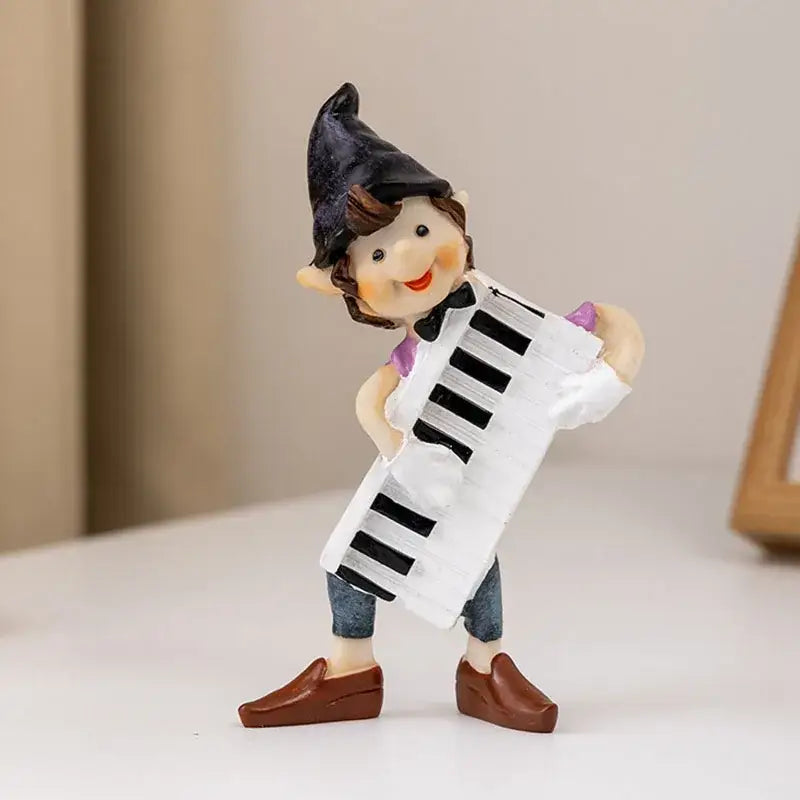 Whimsical clown resin art statue of a smiling elf in a black hat with a white accordion for decorbites clown resin collection