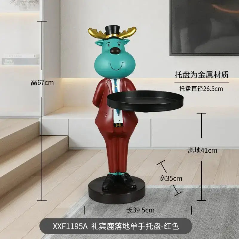 Turquoise reindeer tray ornament dressed in red suit and black top hat holding round metal deer landing tray ornament