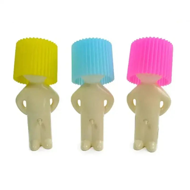 Whimsical orange creative night light decorbites featuring three beige silicone cupcake-shaped figures with colorful hats