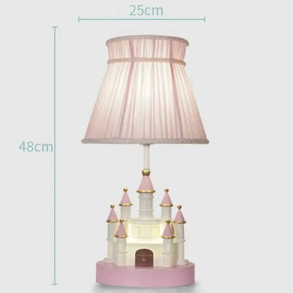 A charming pink and white decorbites castle kids chandelier led table lamp with pleated fabric shade for bedrooms