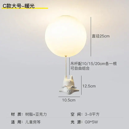 White ceramic flying pig resin led ceiling light with frosted spherical shade for whimsical bedroom decor