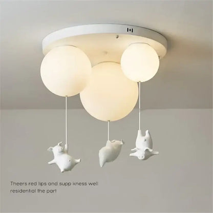 White ceramic pig resin led ceiling light with spherical frosted glass shades for whimsical bedroom decor