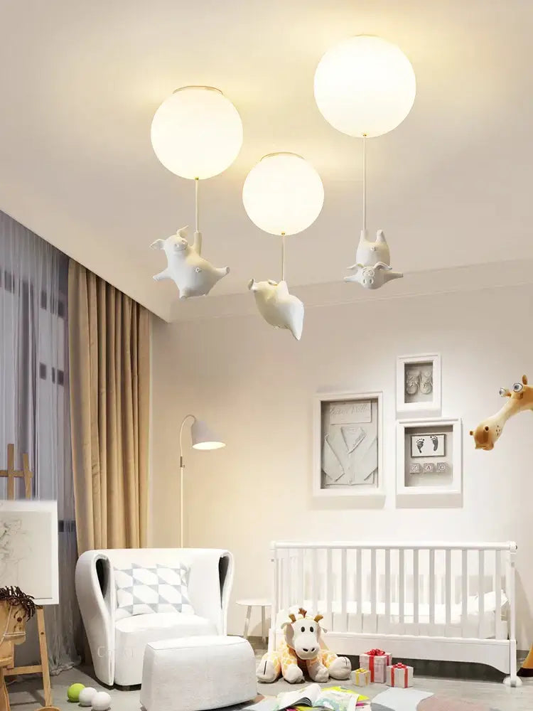 White spherical ceiling light with whimsical flying pig resin led animal-shaped pendants for bedroom decor