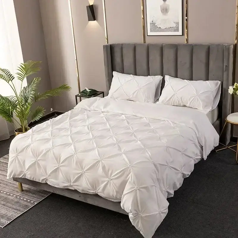 White 3d pinch pleat duvet cover set with diamond pattern featuring soft quilted fabric and matching pillows for bedroom use