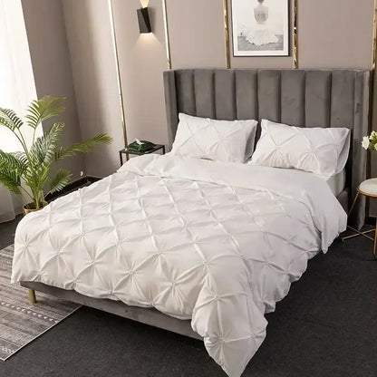 White 3d pinch pleat duvet cover set with diamond pattern featuring soft quilted fabric and matching pillows for bedroom use