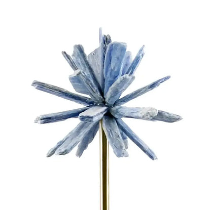 Delicate blue crystal cluster pin with starburst design on gold stem alongside white agate flower home decor figurine
