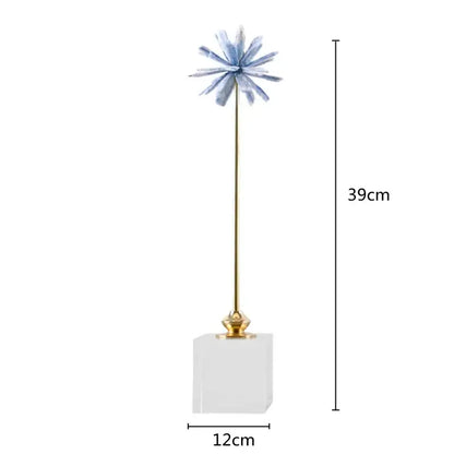 Delicate blue crystalline flower home decor figurine with slender gold stem on clear acrylic base for living room decor