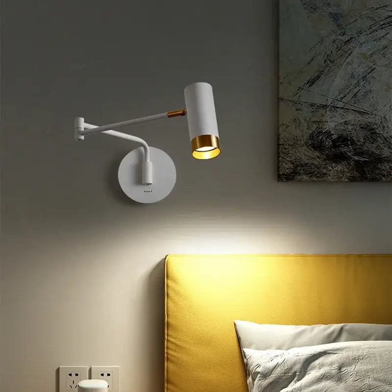 White wall lamp with brass-accented cylindrical head and articulated arm from decorbites astronaut wall sconces