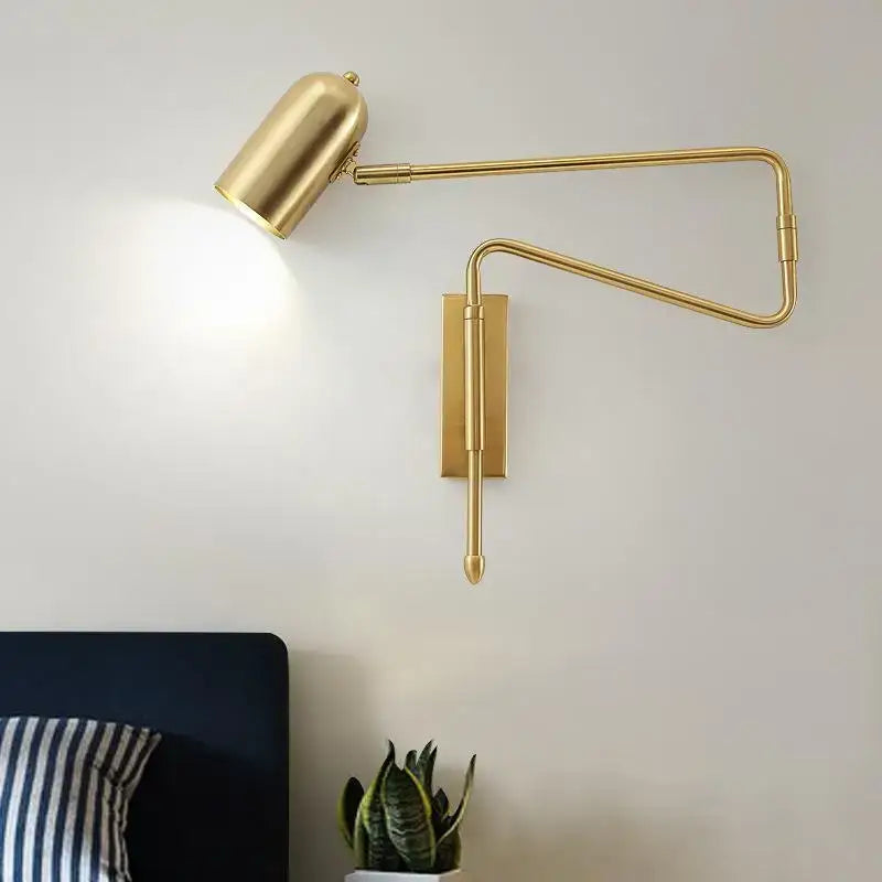 Gold-finished adjustable wall lamp with articulated arm and cylindrical head from decorbites astronaut wall sconces collection