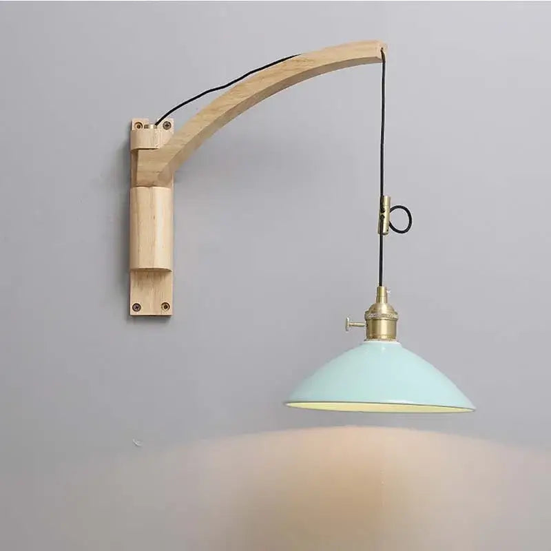 A light blue enamel pendant wall lamp with brass fixture and arched wooden arm for decorbites astronaut wall sconces