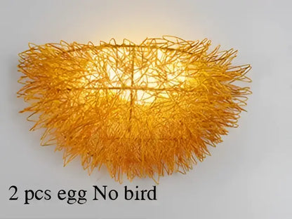 Golden feathery lampshade with woven wireframe design on white and gold ceramic birds nest wall lamp for children room