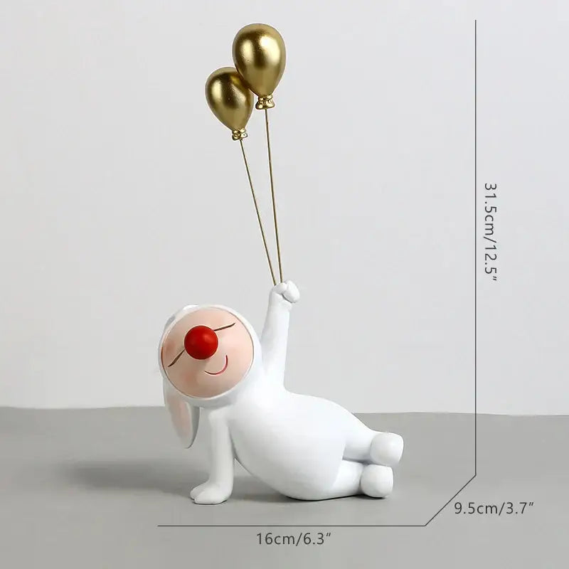 White and gold ceramic clown bust sculpture featuring a white bunny with a red nose holding gold balloons for kids room candy tray