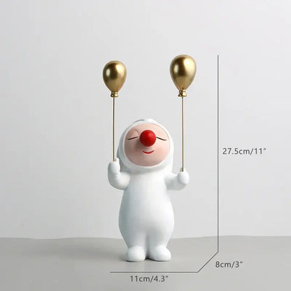 White and gold ceramic clown bust sculpture with red nose holding two gold balloons for kids room candy tray