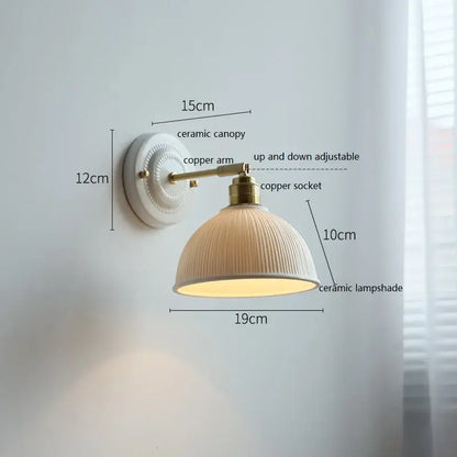 White and gold ceramic led wall light with cream ribbed lampshade and brass copper arm from decorbites ceramic led collection