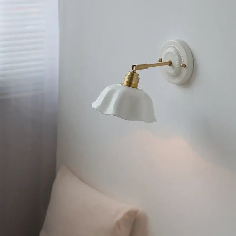 White and gold ceramic led wall light with metal arm and decorative base for bedroom decorbites ceramic led wall use