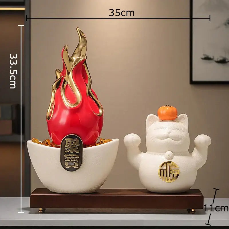 White and gold ceramic lucky cat feng shui ornament with red and gold flame decoration in white bowl for living room decor
