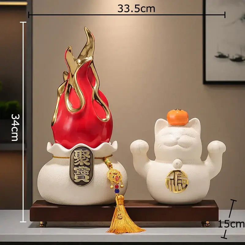 Red and gold flame-shaped ceramic feng shui ornament with chinese characters on white base for living room decor
