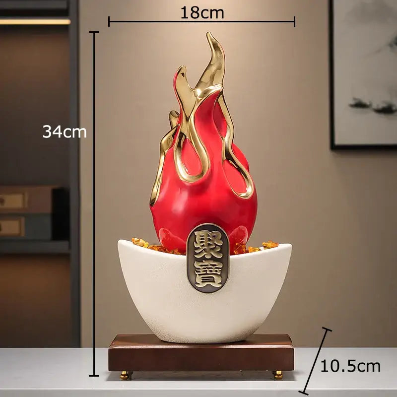 Red and gold flame-shaped decorative feng shui ornament with white ceramic base featuring chinese characters for living room decor