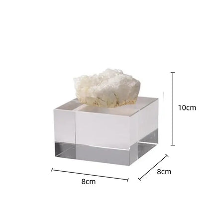 A translucent acrylic stand displaying a white crystalline geode with delicate branching formations for crystal coralline ornaments living room decor