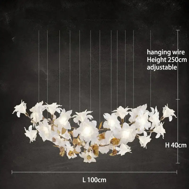 A modern white orchid decorbites crystal flower chandelier with adjustable wire and gold-toned accents for dining rooms