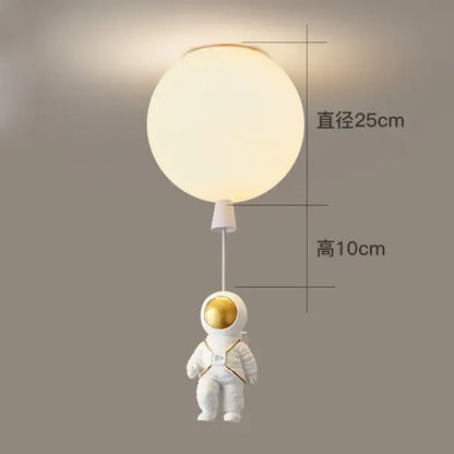 White and gold decorbites astronaut space ball ceiling lamp features a glowing spherical light with astronaut figurine