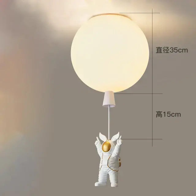 White and gold decorbites astronaut space ball ceiling lamp featuring a frosted glass globe for kids room lighting