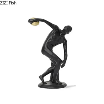 Black metallic discus thrower resin sculpture holding a golden discus for white and gold living room decor