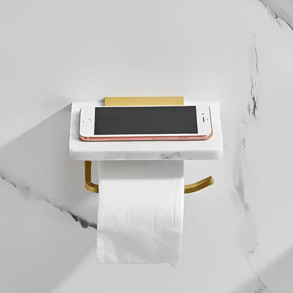 White and gold marble toilet paper holder with gold marble metal accents and a sleek rectangular iphone platform decorbites gold marble