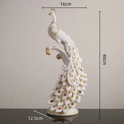 Elegant white and gold peacock sculpture with eye-like tail markings on decorative base for home decor by decorbites golden phoenix