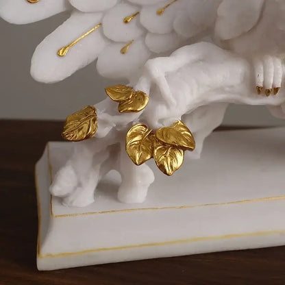 White marble angel figurine with golden leaf accents and detailed wings for elegant home decor by decorbites golden phoenix