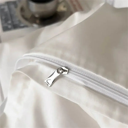 White satin pillowcase with silver zipper pull part of white and gray egyptian cotton bedding set decorbites 1200tc embroidered