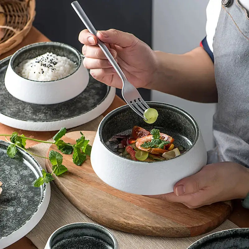 White and grey ice cracked glaze ceramic bowl with speckled interior holding vegetables and shrimp by decorbites ice cracked