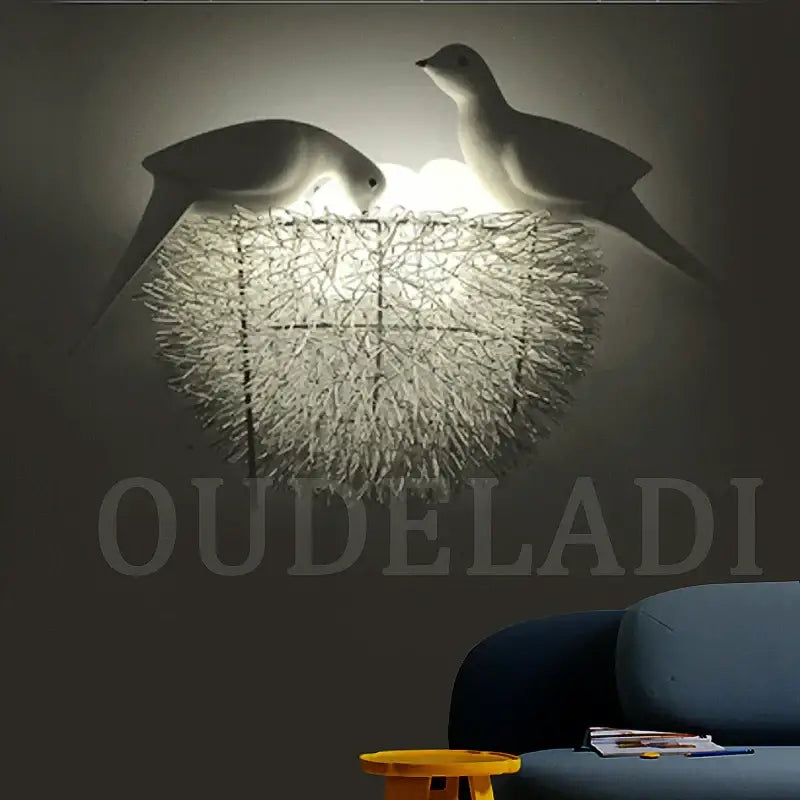 White and orange bird nest led wall lamp with sculptural birds and textured nest design for bedroom decor