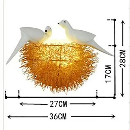 White and orange bird nest led wall lamp featuring a warm golden hue with two white doves for bedroom decor