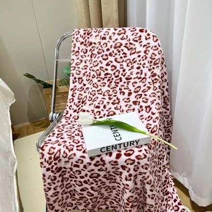 Pink leopard print fleece blanket decorbites leopard print warm blanket draped over a chair for bedroom decor