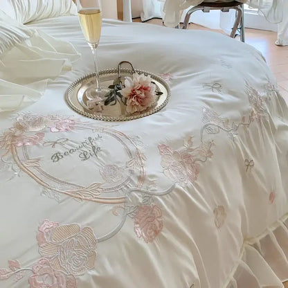 Cream-colored satin bedding set with delicate white and pink 4pcs flowers embroidery and beautiful life stitched design