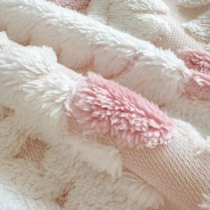 White and pink plush bunny ears with fluffy texture on subtle knit background complement decorbites geometric jacquard taff velvet blanket