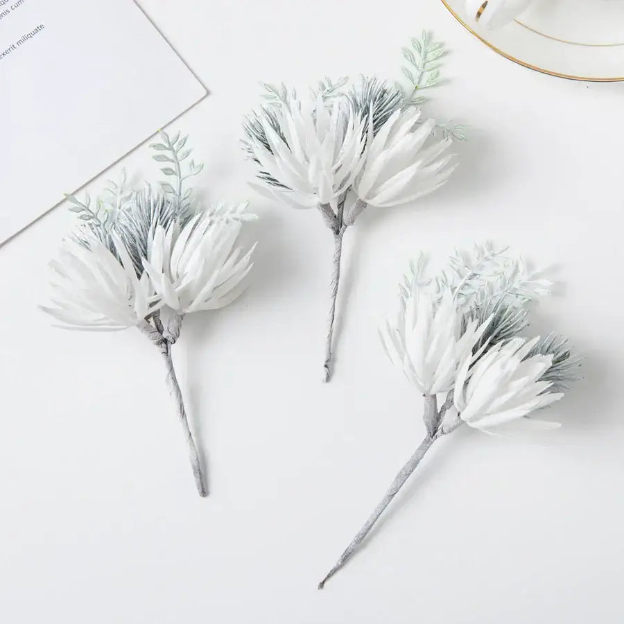 White and silver artificial flowers garland with feathery petals and green leaves for wedding decor and living room use by decorbites artificial flowers