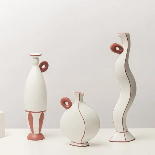 Three white ceramic vases with terracotta handles and geometric black lines for living room decor